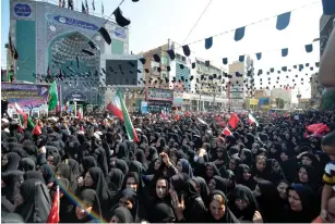  ?? (Tasnim News Agency/Reuters) ?? WOMEN GATHER in the streets of Ahvaz, Iran, during a funeral yesterday for the 25 people killed in an attack on Saturday.