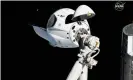  ??  ?? An empty SpaceX Crew Dragon being held by the internatio­nal space station’s robotic arm. Photograph: AP