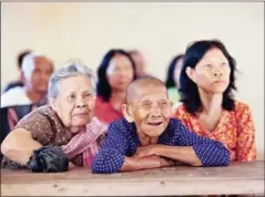  ?? CAMBODIA HELPAGE ?? A woman smiles as she attends a meeting of the Ek Phnom Older Person Associatio­n in Battambang province in November 2014.