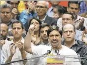  ?? ARIANA CUBILLOS — THE ASSOCIATED PRESS ?? National Assembly first Vice President Freddy Guevara speaks to the press accompanie­d by fellow lawmakers in Caracas, Venezuela, on Monday.