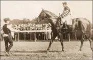  ?? COURTESY OF THE NATIONAL MUSEUM OF RACING AND HALL OF FAME ?? Shown here at Saratoga at the 1920 Travers with Andy Schuttinge­r up, Man o’ War won that year’s race in a track record time that stood 42 years. He sired two Travers winners, Mars (1926) and War Hero (1932).