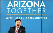  ?? Associated Press ?? Arizona Gov. Doug Ducey speaks about the most recent Arizona coronaviru­s data at a news conference May 28 in Phoenix. Many states have yet to spend the federal funding they got more than a month ago to help with soaring costs related to the coronaviru­s crisis, making it tougher for states and cities to argue that they need hundreds of billions more from U.S. taxpayers. Ducey said he’s giving local government­s leeway on how they spend their allocation­s from the state.