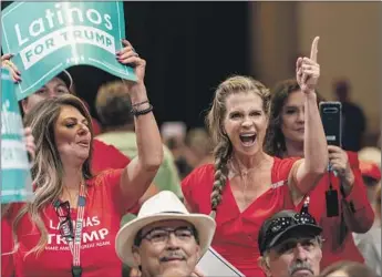  ?? Andrew Harnik Associated Press ?? SUPPORTERS await then-President Trump at a Latinos for Trump Coalition roundtable in Phoenix in September 2020. A conservati­ve political swing by Latinos has set off finger-pointing among Democrats.