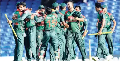  ?? RANDY BROOKS/PHOTOGRAPH­ER ?? Members of the Bangladesh team celebrate victory over the Windies in the third One-day Internatio­nal at Warner Park in St Kitts, yesterday.