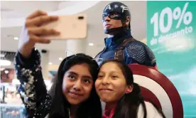  ??  ?? Girls take a selfie with Captain America during an early premiere of Avengers: Endgame in La Paz, Bolivia. Photograph: David Mercado/Reuters