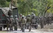  ?? — PTI ?? Army soldiers cordon off the area near the house where top Hizbul Mujahideen commanders were hiding during an encounter in Handwara, J&amp; K, on Thursday.