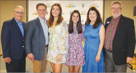  ?? (NWA Democrat-Gazette/Carin Schoppmeye­r) ?? Lee Scott (from left), Eric Scott, Sophia Scott, Amelia Scott, Elda Scott and Sam Dean, Scott Family Amazeum executive director, stand for a photo at the announceme­nt of a $10.35 million gift from the Scott family to the children’s museum in Bentonvill­e.