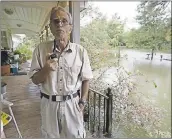  ?? ROGELIO V. SOLIS — THE ASSOCIATED PRESS ?? Jimmie Bradley speaks about the flooding in his neighborho­od in Moss Bluff, Louisiana, on Monday.