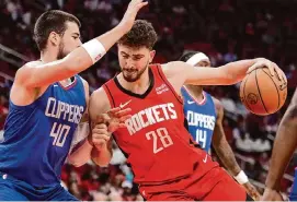  ?? Brett Coomer/Staff photograph­er ?? Rockets center Alperen Şengün tallied the fourth triple-double of his career on Wednesday against the Clippers, including career-highs in rebounds and assists.