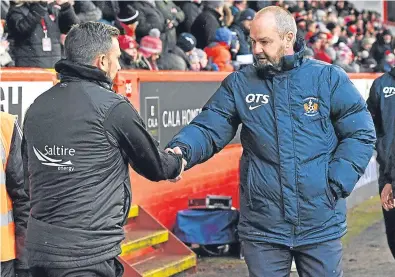  ?? Picture: SNS. ?? Derek McInnes and Steve Clarke shake hands before the quarter-final at Pittodrie, but their relationsh­ip has been less amicable in the run-up to the replay.