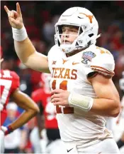  ?? Butch Dill/Associated Press file photo ?? ■ Texas quarterbac­k Sam Ehlinger (11) celebrates his second touchdown carry in the first half of the Sugar Bowl on Jan. 1 against Georgia in New Orleans.