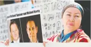  ?? JASON REDMOND / AFP / GETTY IMAGES FILES ?? A protester holds a photo of the Canadian detainees at a May court appearance for Huawei CFO Meng Wanzhou.