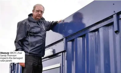  ??  ?? Dismay BRCFC chair Sandy Thomson inspects the damaged solar panels