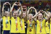  ?? TERTIUS PICKARD — THE ASSOCIATED PRESS ?? Sweden gesture to supporters as they celebrate with their bronze medals after defeating Australia in the Women's World Cup third place playoff soccer match in Brisbane, Australia, on Saturday.
