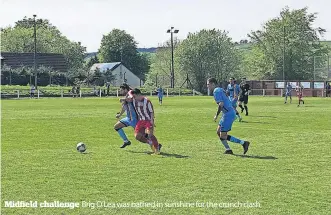  ?? ?? Midfield challenge Brig O’Lea was bathed in sunshine for the crunch clash