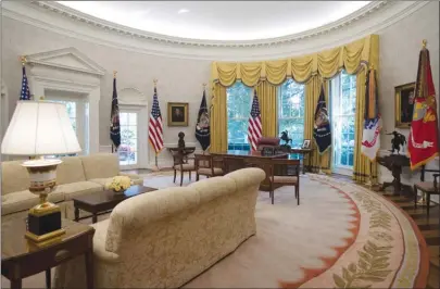  ?? The Associated Press ?? The newly refreshed Oval Office of the White House is shown during a media tour. New wallpaper was hung and the floors were refinished this month as part of a series of updates to the West Wing.