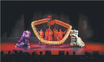  ?? PROVIDED TO CHINA DAILY ?? A Chinese dragon dance group and a Finnish lion dance team perform together in Helsinki, Finland, on Monday.