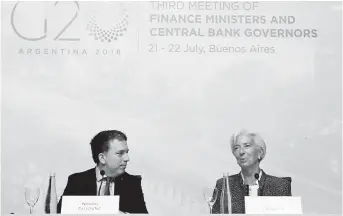  ??  ?? Argentine Treasury Minister Nicolas Dujovne (left) and Managing Director of the Internatio­nal Monetary Fund Christine Lagarde attend G20’s press conference in Buenos Aires, Argentina, on July 21. — Xinhua