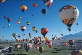  ?? Photo by Ron Behrmann ?? The Albuquerqu­e Internatio­nal Balloon Fiesta takes place Oct. 3 through 11.