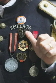  ??  ?? Amster displays the detail on his Emperor Norton costume. Amster is back leading outdoor city tours after a pandemic hiatus.