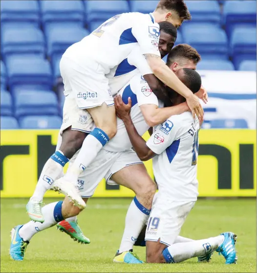  ?? PICTURES:Action Images ?? BUNDLE: Cole Stockton celebrates with his team-mates after scoring