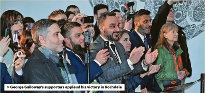  ?? ?? > George Galloway’s supporters applaud his victory in Rochdale