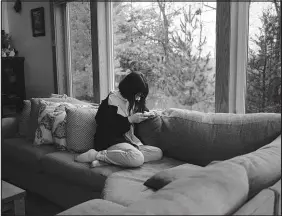  ?? ANNIE FLANAGAN / THE NEW YORK TIMES FILE (2021) ?? A teenage girl is shown at her home in Minnesota. The Youth Risk Behavior Survey, which showed a stark rise in sadness among teen girls, was given to 17,000 adolescent­s at high schools across the United States in the fall of 2021.