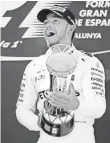  ?? ANDREU DALMAU, EPA ?? Lewis Hamilton celebrates after his Spanish Grand Prix victory.