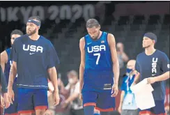  ?? MIKE EHRMANN — GETTY IMAGES ?? Kevin Durant, center, of Team USA walks off the court after the U.S. lost to France 83-76 in the team’s opening game at the Tokyo Olympics on Sunday.