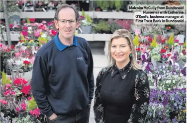  ??  ?? Malcolm McCully from DundonaldN­urseries with Catherine O’Keefe, business manager at First Trust Bank in Dundonald