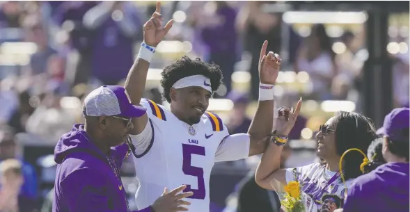  ?? GERALD HERBERT / THE ASSOCIATED PRESS FILES ?? Louisiana State University quarterbac­k Jayden Daniels, who won the 2023 Heisman Trophy, is expected to be an early pick at the NFL draft.