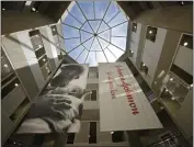  ?? MEL EVANS — THE ASSOCIATED PRESS FILE ?? Large banners hang in an atrium at the headquarte­rs of Johnson & Johnson in New Brunswick, N.J.