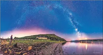  ??  ?? One of Peter Ribeck’s well known images called Milky Way over Holy Isle.