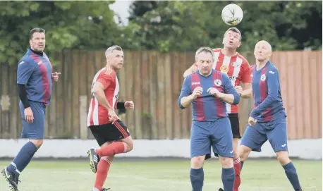  ??  ?? Mill View Over-40s (red & white) playing Hall Farm last Saturday morning.