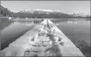  ?? AP/FEDERICO GROSSO ?? Snow covers a dock Monday in Villa La Angostura in southern Argentina. The National Meteorolog­ical Service said the cold front arrived from the South Pole.