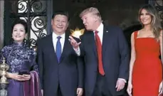  ?? Alex Brandon/AP ?? President Donald Trump and his wife, Melania, meet Chinese President Xi Jinping and his wife, Peng Liyuan, at Mar-a-Lago last year.