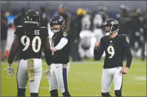  ?? The Associated Press ?? MADE IT IN: Baltimore Ravens kicker Justin Tucker reacts after kicking a field goal Sunday during the second half of an NFL game against the Tennessee Titans in Baltimore. The Titans won 30-24 in overtime.