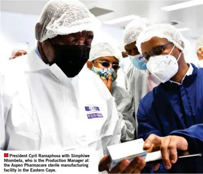 ??  ?? President Cyril Ramaphosa with Simphiwe Ntombela, who is the Production Manager at the Aspen Pharmacare sterile manufactur­ing facility in the Eastern Cape.
