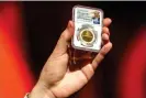  ?? Photograph: Alex Brandon/AP ?? A bitcoin token later presented to Donald Trump at the conference.