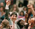  ?? (AP file photo) ?? North Carolina State Coach Jim Valvano (left) celebrates after the team’s victory over Houston to win the NCAA Tournament championsh­ip April 4, 1983, in Albuquerqu­e, N.M. Fans are left to wonder which teams could have had Cinderella runs in the NCAA Tournament similar to that of Valvano’s North Carolina State team that year.