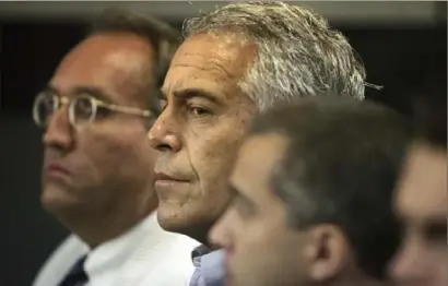  ?? Uma Sanghvi/ Associated Press ?? Jeffrey Epstein, center, appears in court on July 30, 2008, in West Palm Beach, Fla.