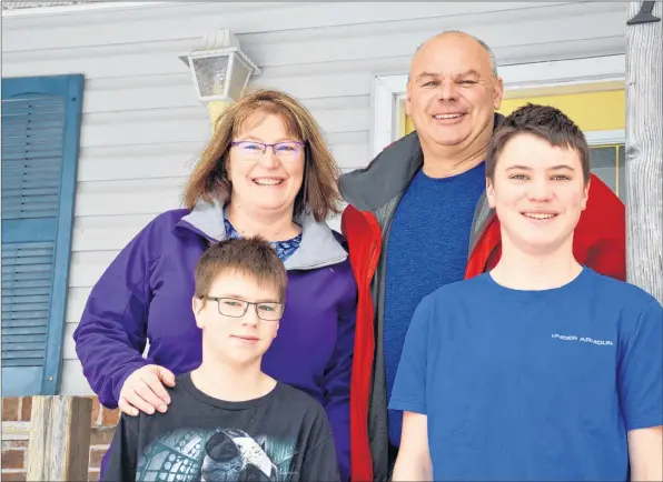  ?? COLIN CHISHOLM ?? Sherri and Larry Miles with two of their four children, Dylan, 13 and Logan, 15. The family is part of a growing trend in East Hants — it’s the only municipali­ty in the province with more young people than seniors.