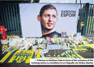  ??  ?? &gt; Tributes to Emiliano Sala in front of the entrance of the training centre La Joneliere in La Chapelle-sur-Erdre, Nantes