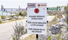  ?? AP ?? A warning sign stands at the entrance of the PDVSA/BOPEC Brasil Terminal in Rincon Bonaire on the Caribbean Netherland­s island of Bonaire, Monday, May 7, 2018, where Venezuela refines and stores its heavy crude.