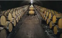  ?? FRANCOIS MORI — THE ASSOCIATED PRESS ?? Empty barrels for the next harvest in autumn in the cave of Champagne producer Anselme Selosse in Avize, in the Champagne region, east of Paris.