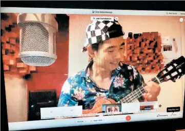  ?? JENNIFER SINCO KELLEHER/AP ?? Ukulele virtuoso Jake Shimabukur­o is seen performing at a Sept. 25 virtual concert.