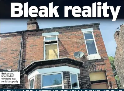  ?? ?? Broken and boarded up windows in a rental property