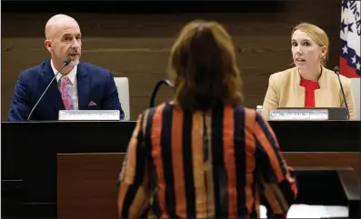  ?? (Arkansas Democrat-Gazette/Thomas Metthe) ?? Arkansas Education Secretary Jacob Oliva (left) and Sarah Moore (right), chair of the state Board of Education, ask questions of Stacy Smith, deputy commission­er for the Division of Elementary and Secondary Education, during the board’s meeting in Little Rock on Wednesday.