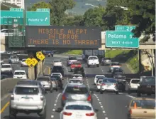  ?? Anthony Quintano / Civil Beat ?? A highway sign in Honolulu advises motorists Saturday that a missile attack warning was mistakenly sent to cell phones.