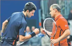  ??  ?? File photo of Novak Djokovic (left) cheering with his coach Marian Vajda during tennis exhibition match. — AFP photo